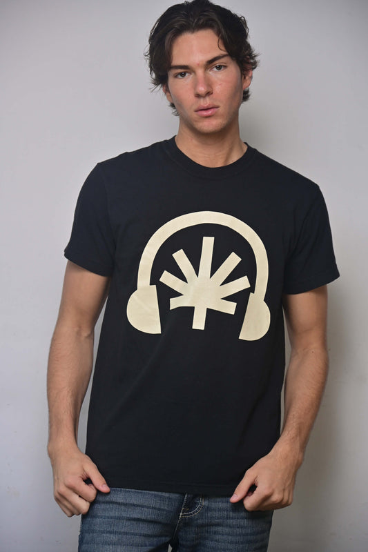 Black tee with cream Headphones front graphic featuring a stylized cannabis leaf (front, on-model)