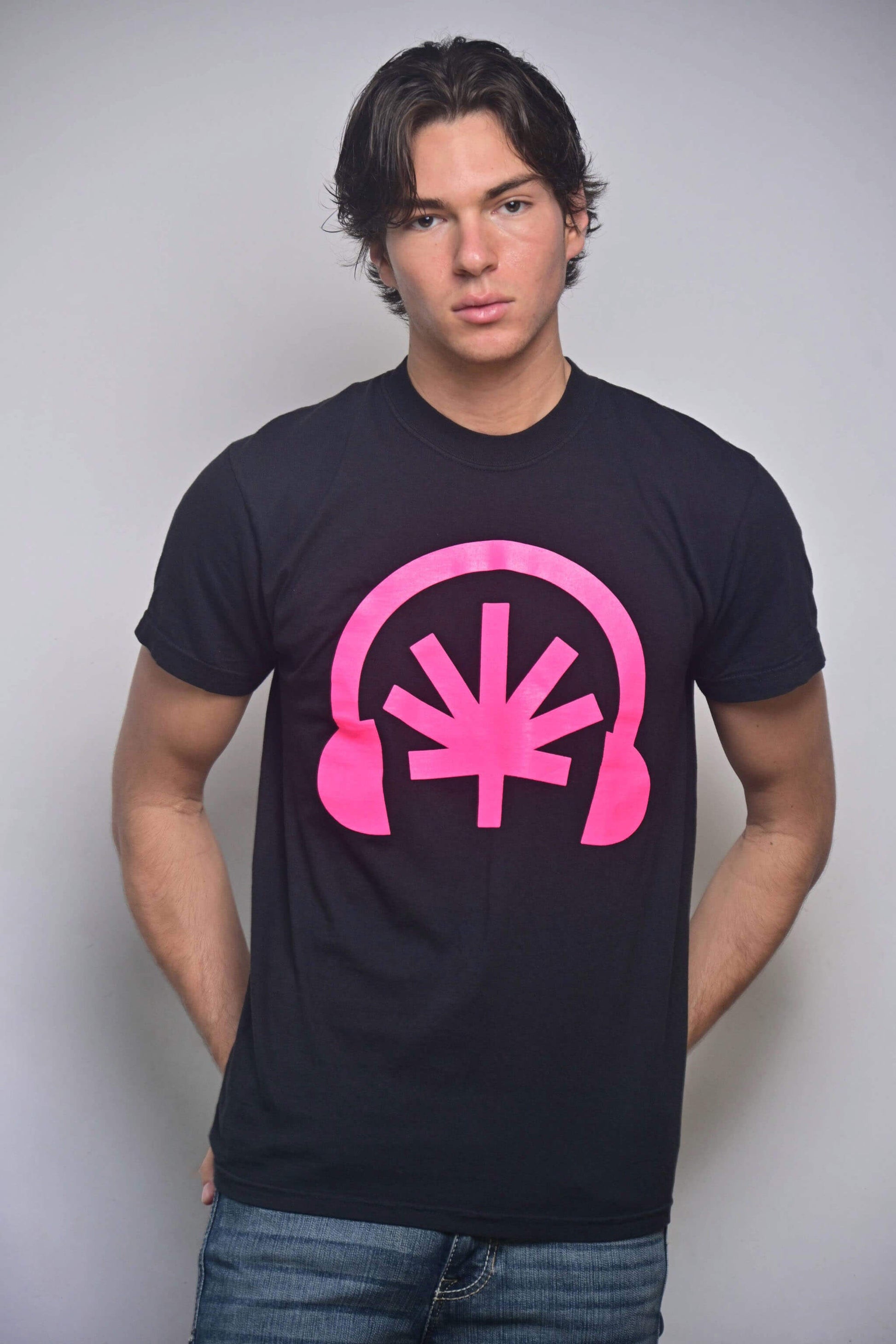 Black tee with hot pink Headphones front graphic featuring a stylized cannabis leaf (front, on-model)